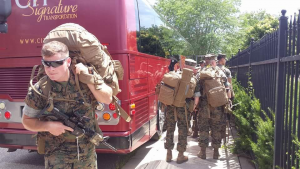 U.S Troops getting on a CIT Signature Transportation Coach bus