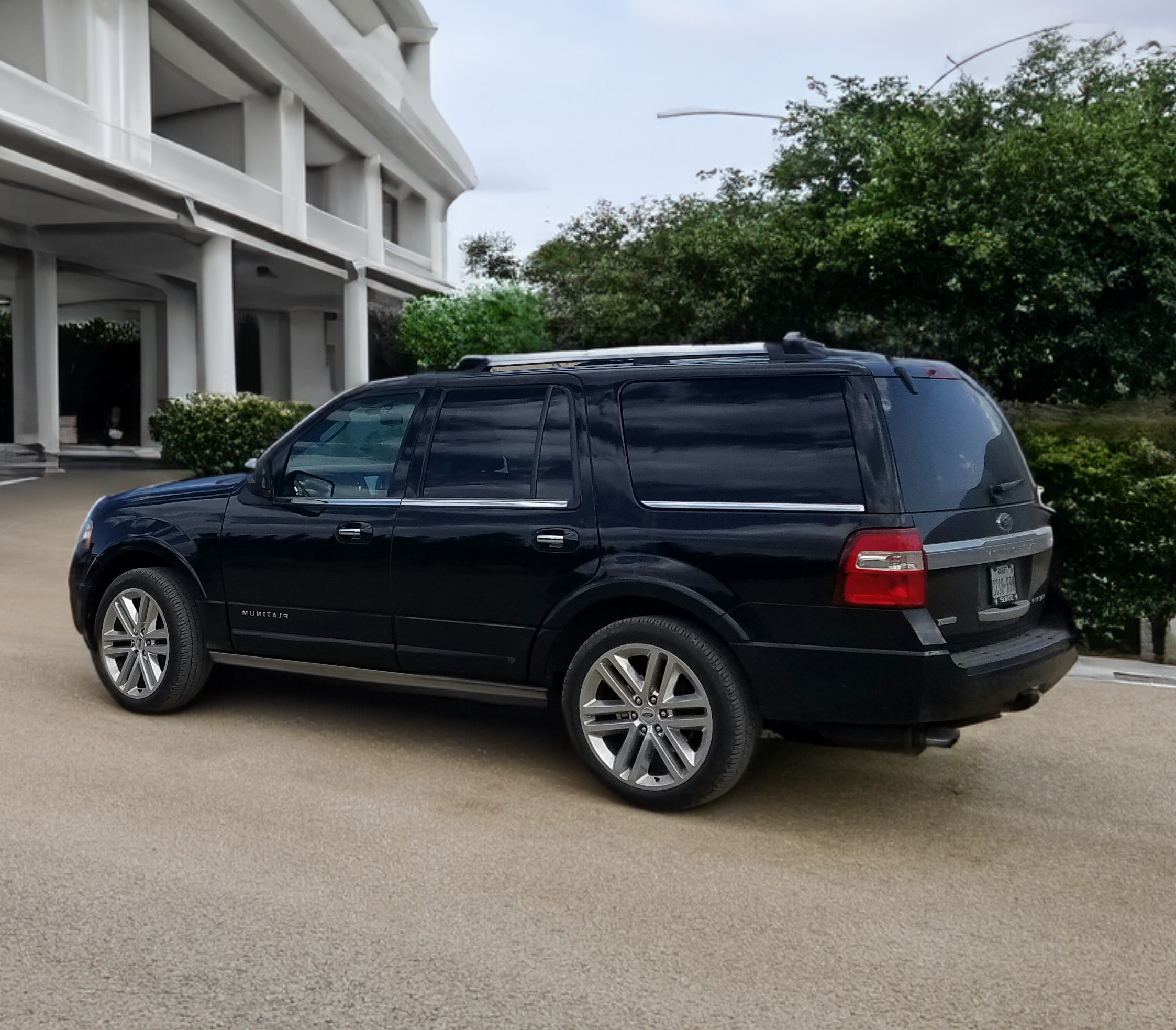 Black Ford Expedition outside of parking garage